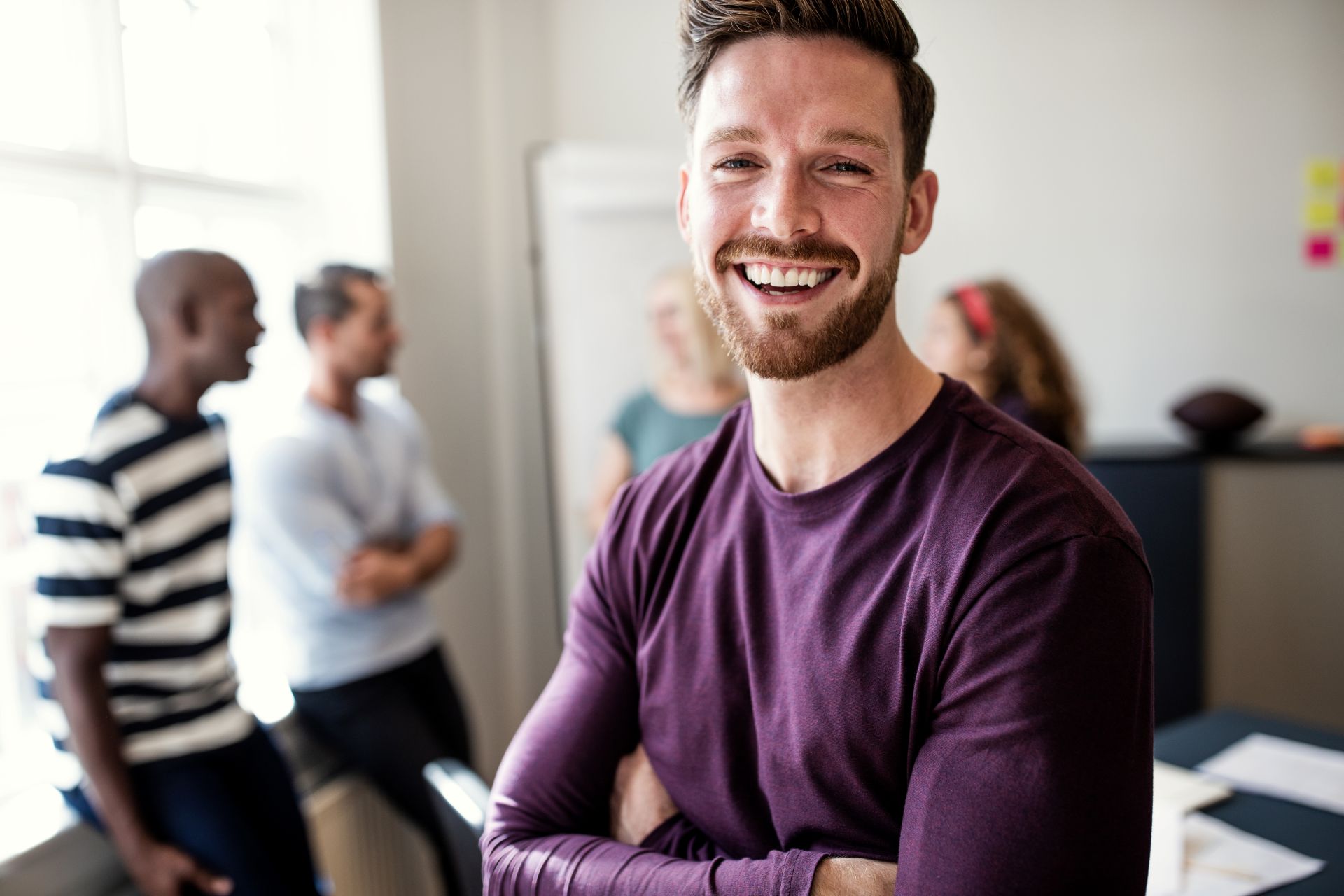 laughing-young-designer-standing-in-an-office-afte-2024-09-14-20-03-28-utc.jpg